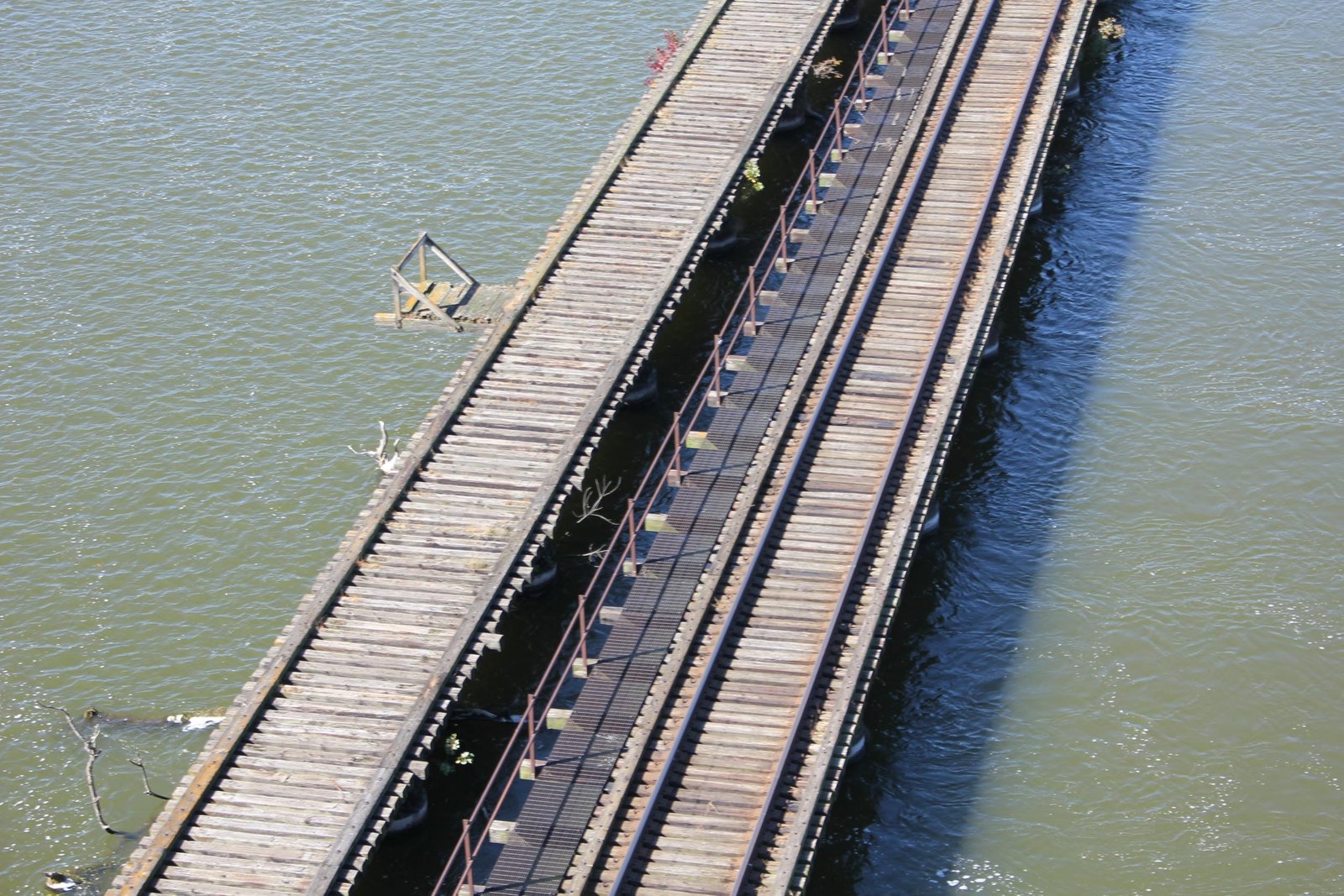 Deck view from Oneida Street Bridge.  C&NW bridge on right, Milwaukee Road bridge on left